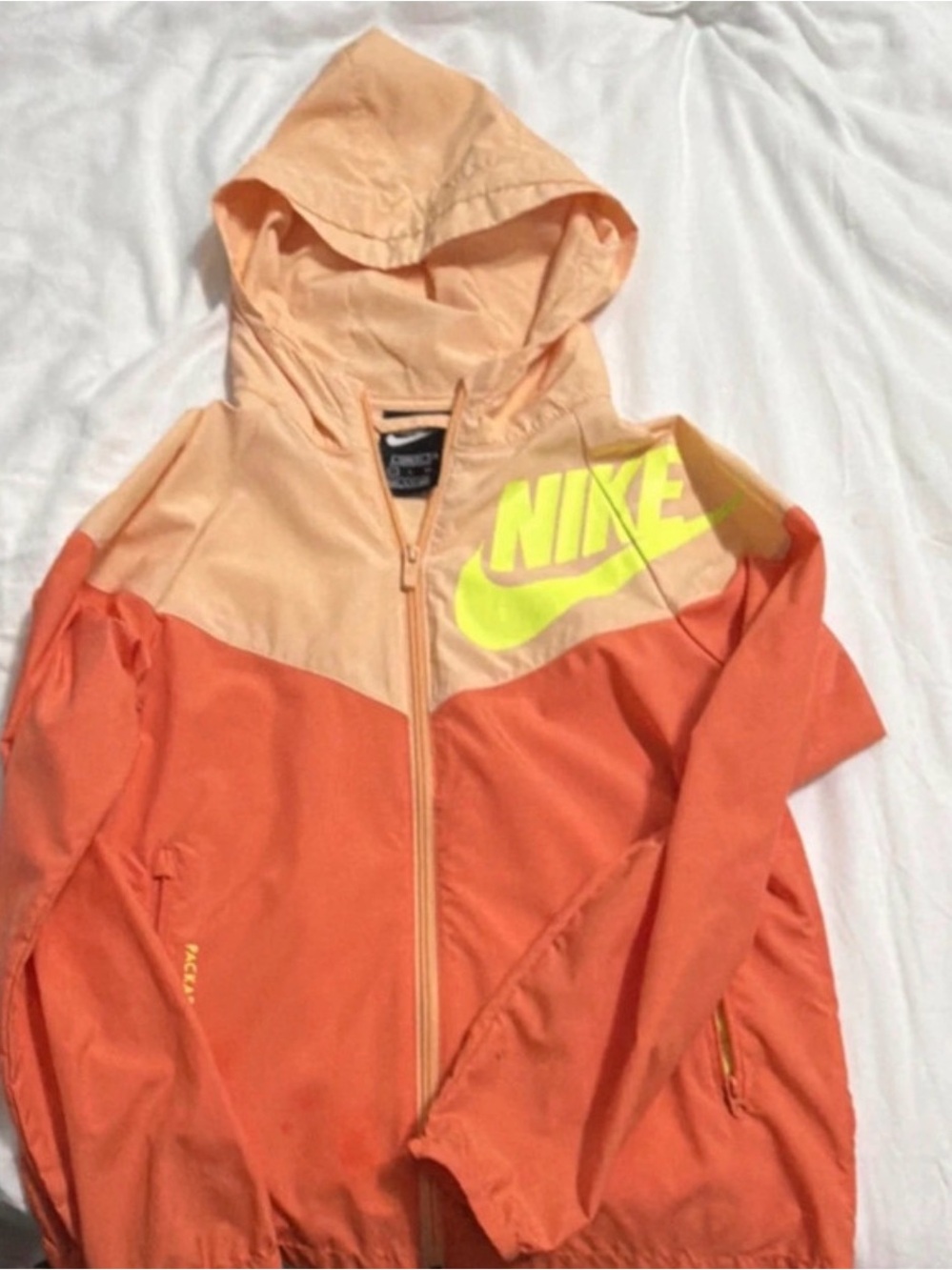 Nike Kids Peach and Coral Colorblock Rain Jacket with Neon Logo